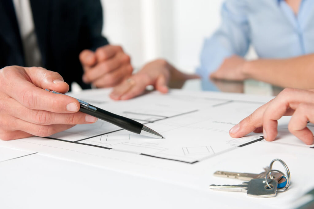Licensed conveyancer explaining property sale contract to client prior to completion